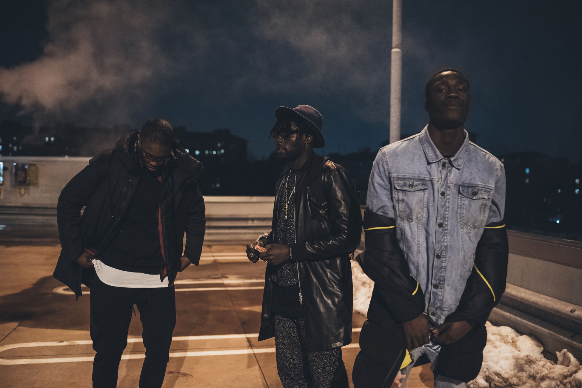 three young men posing outdoor looking camera serious - rap crew, gang, swag concept